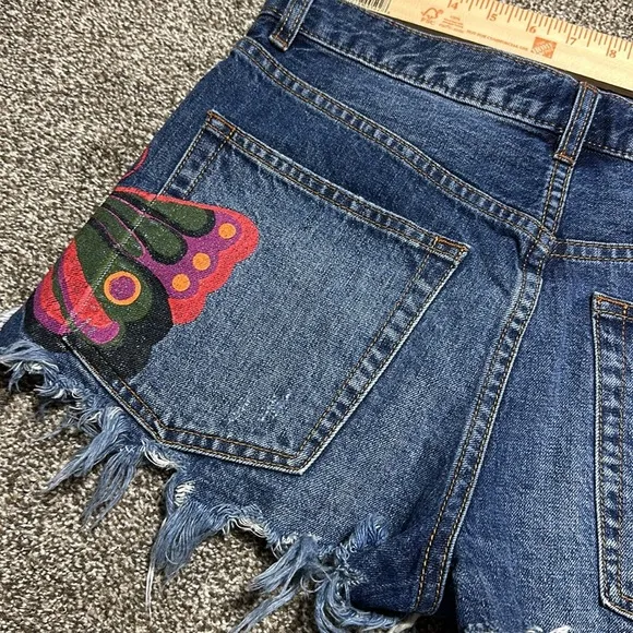 Free people cutoff Jean shorts fields of sun painted butterfly button fly summer