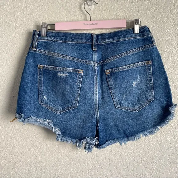 Free People Medium Wash Distressed Raw Hem Denim Shorts