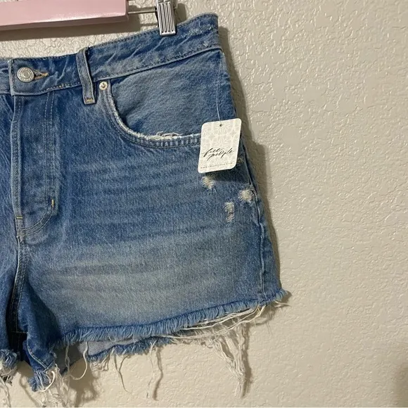 Free People We the Free Beach Bum Distressed Medium Wash Denim Shorts