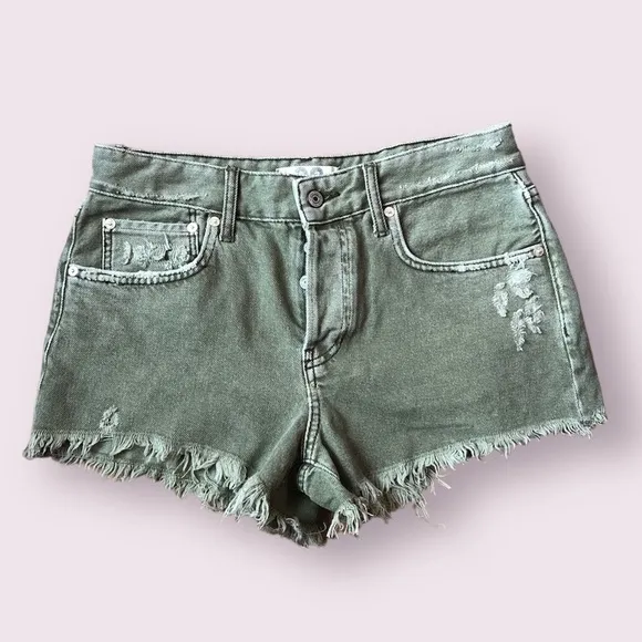 Free People We The Free green frayed hem denim shorts in size 28