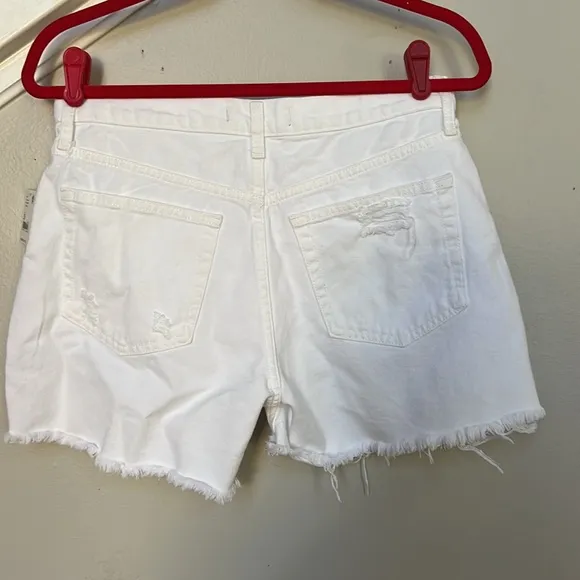 Free PeopleMaggie Mid Rise Frayed Hem Distressed Denim Shorts.