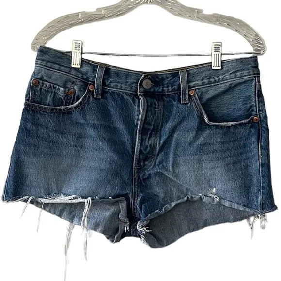 Levi’s 501 cut off button fly distressed medium wash denim shorts, Size 29